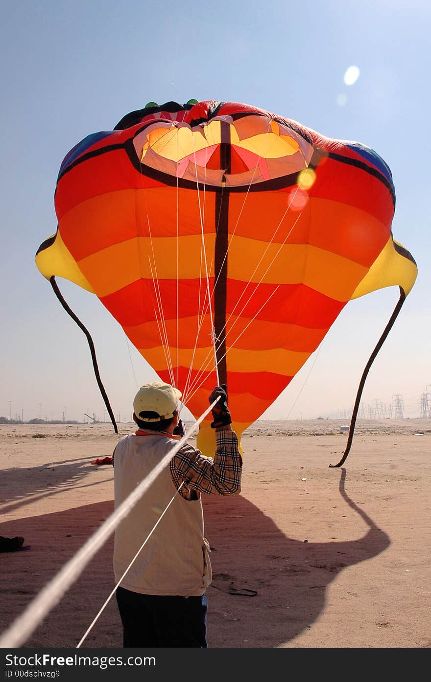 A man Holding  a huge PaperPlane in one Hand in kuwait. A man Holding  a huge PaperPlane in one Hand in kuwait