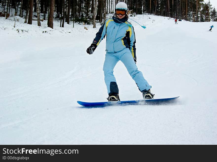 Girl Show Tongue On Snowboard