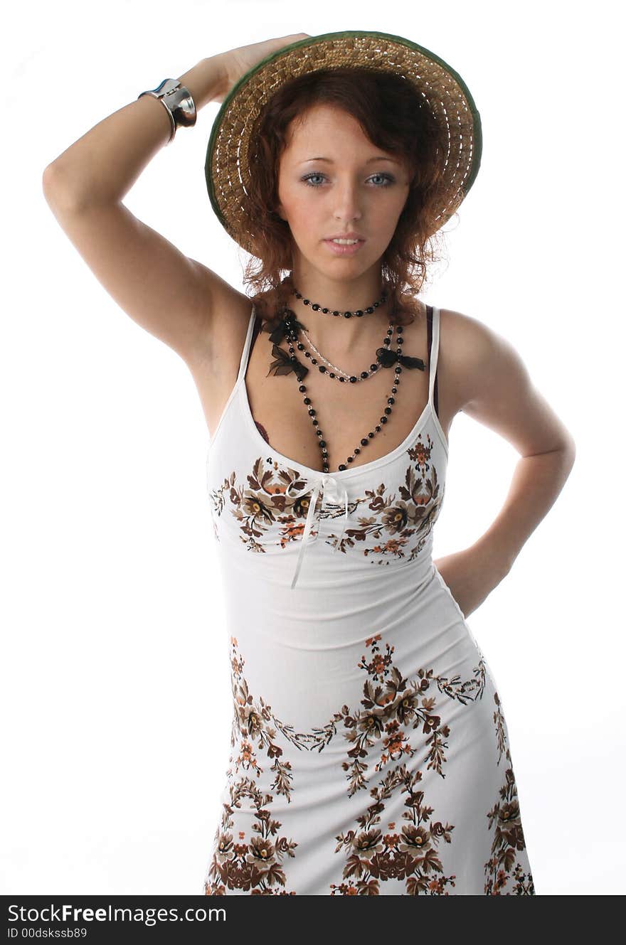 The girl in a sundress and a straw hat on a white background. The girl in a sundress and a straw hat on a white background