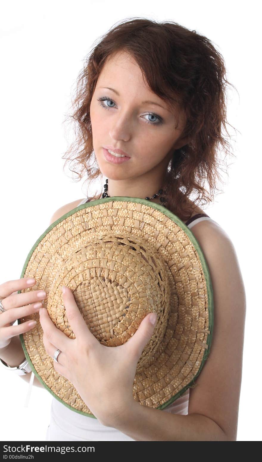 The girl in a sundress and with straw hat on a white background. The girl in a sundress and with straw hat on a white background
