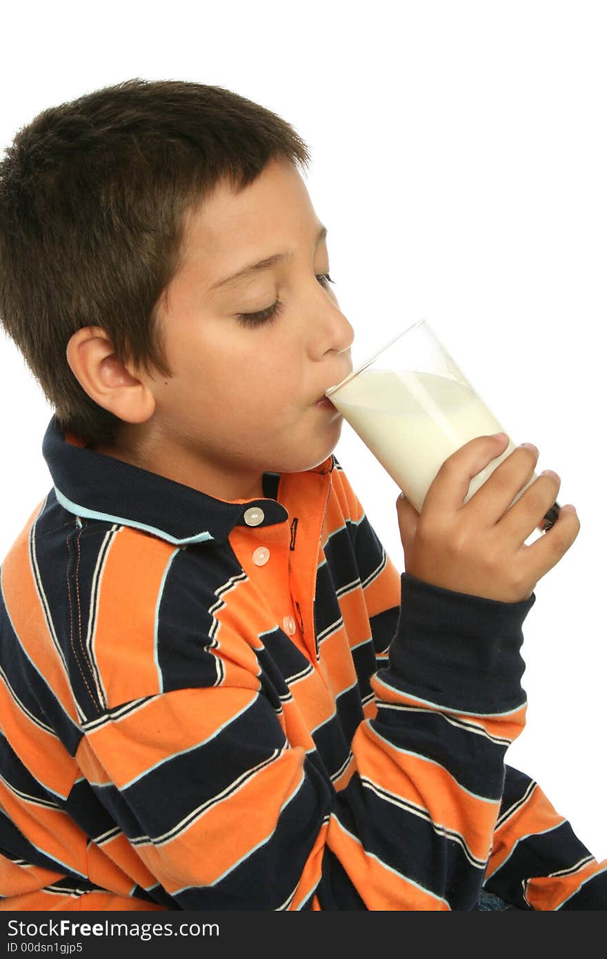 Boy drinking a glass of milk