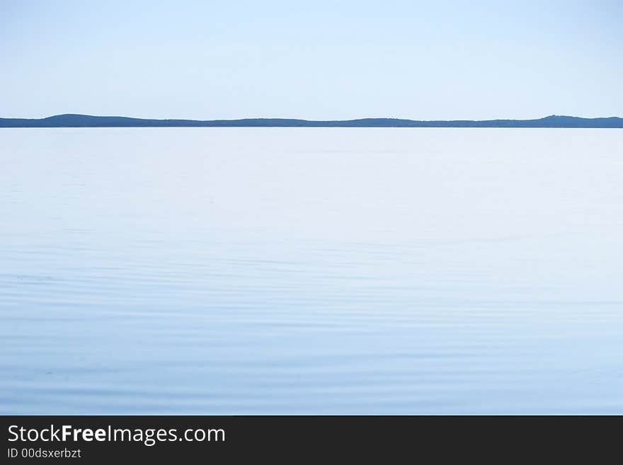 Blue lagoon with distant skyline. Blue lagoon with distant skyline