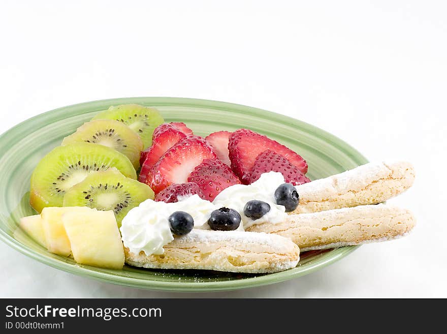 Strawberries,kiwi,pineapple,blue berries,whipped and lady fingers combine to make this an appealing dessert. Strawberries,kiwi,pineapple,blue berries,whipped and lady fingers combine to make this an appealing dessert.