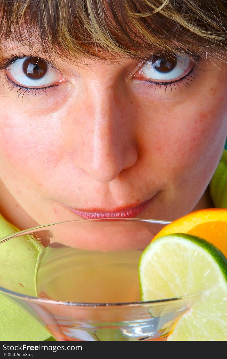 Woman looking up from her drink. Woman looking up from her drink.