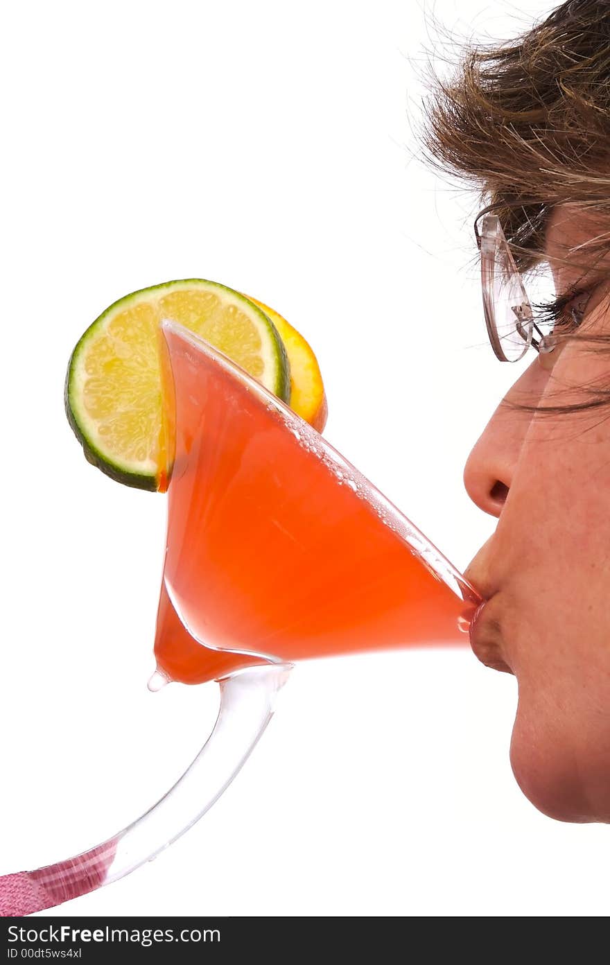 Woman drinking a colorful tropical drink.