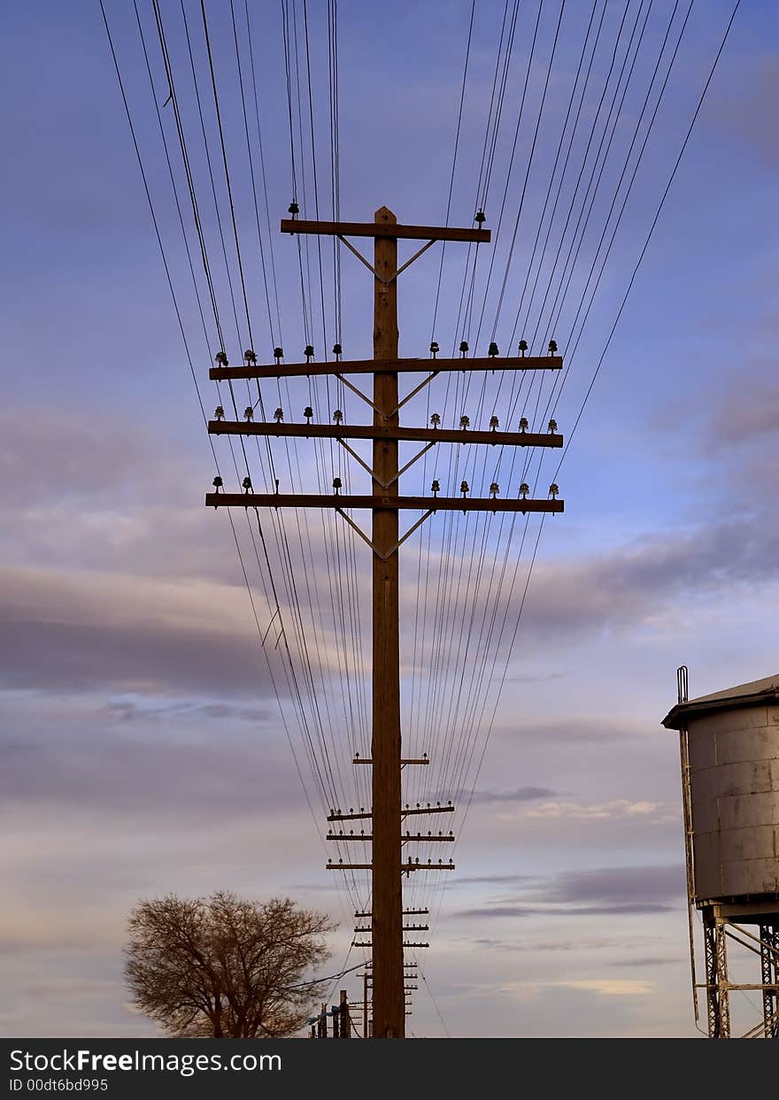 Telegraph wires and poles at sunset. Telegraph wires and poles at sunset