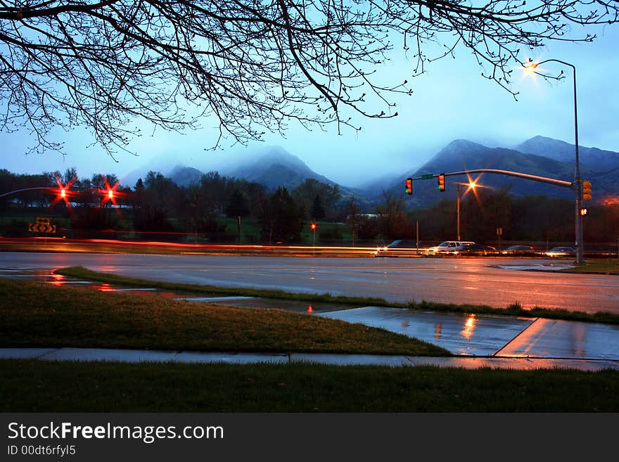 Rain and traffic at a busy intersection make for an explosion of events to be viewed. Rain and traffic at a busy intersection make for an explosion of events to be viewed