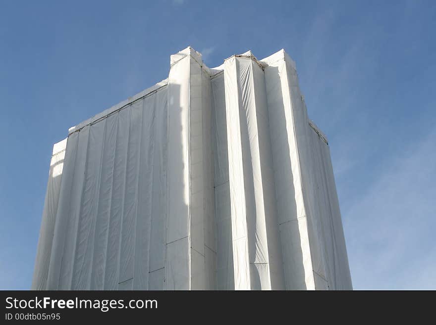 Currently under renovation, this high-rise tower is encased in white sheets. Currently under renovation, this high-rise tower is encased in white sheets.