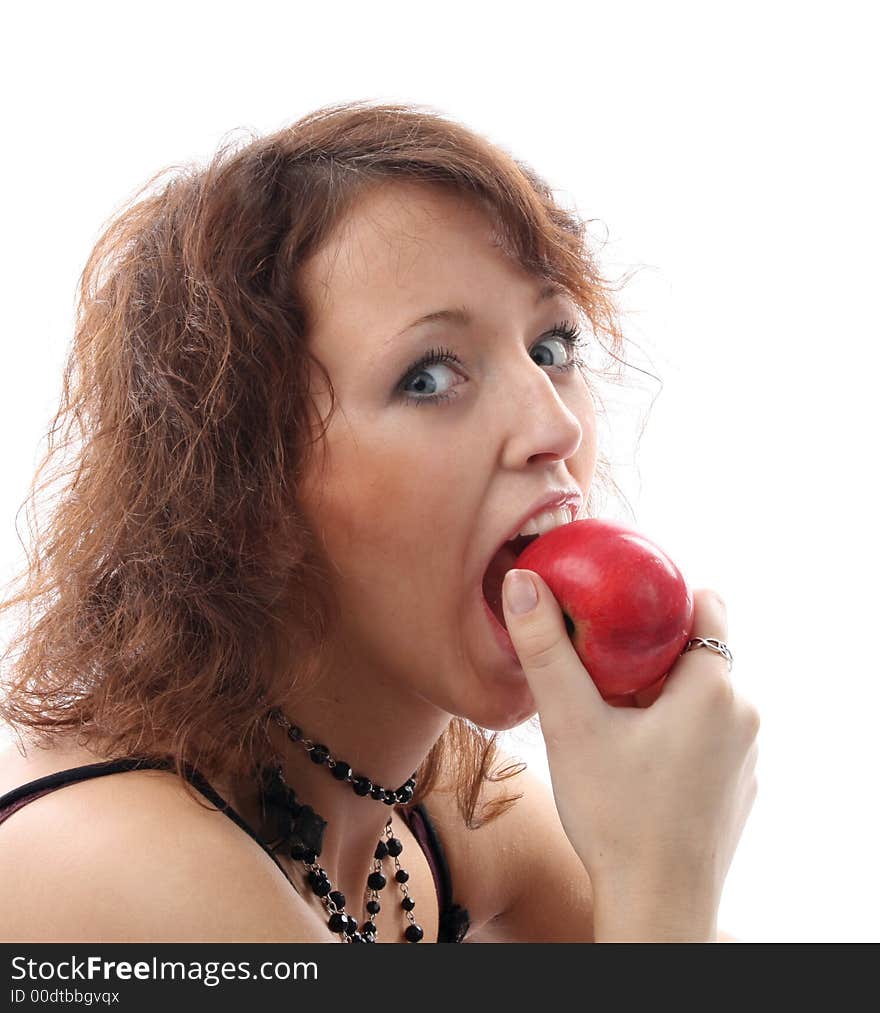 The girl bites a red apple. The girl bites a red apple