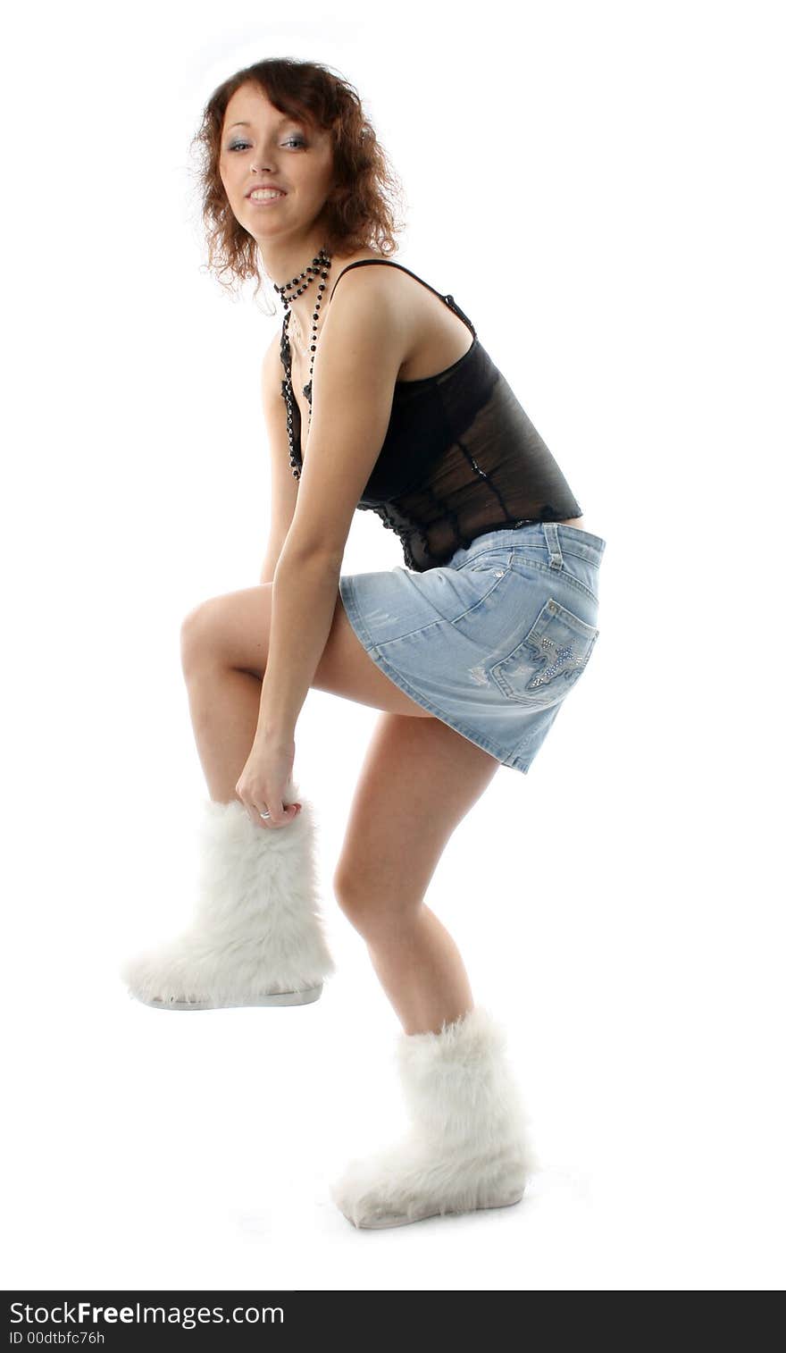 The girl adjust for fur white boots. The girl adjust for fur white boots