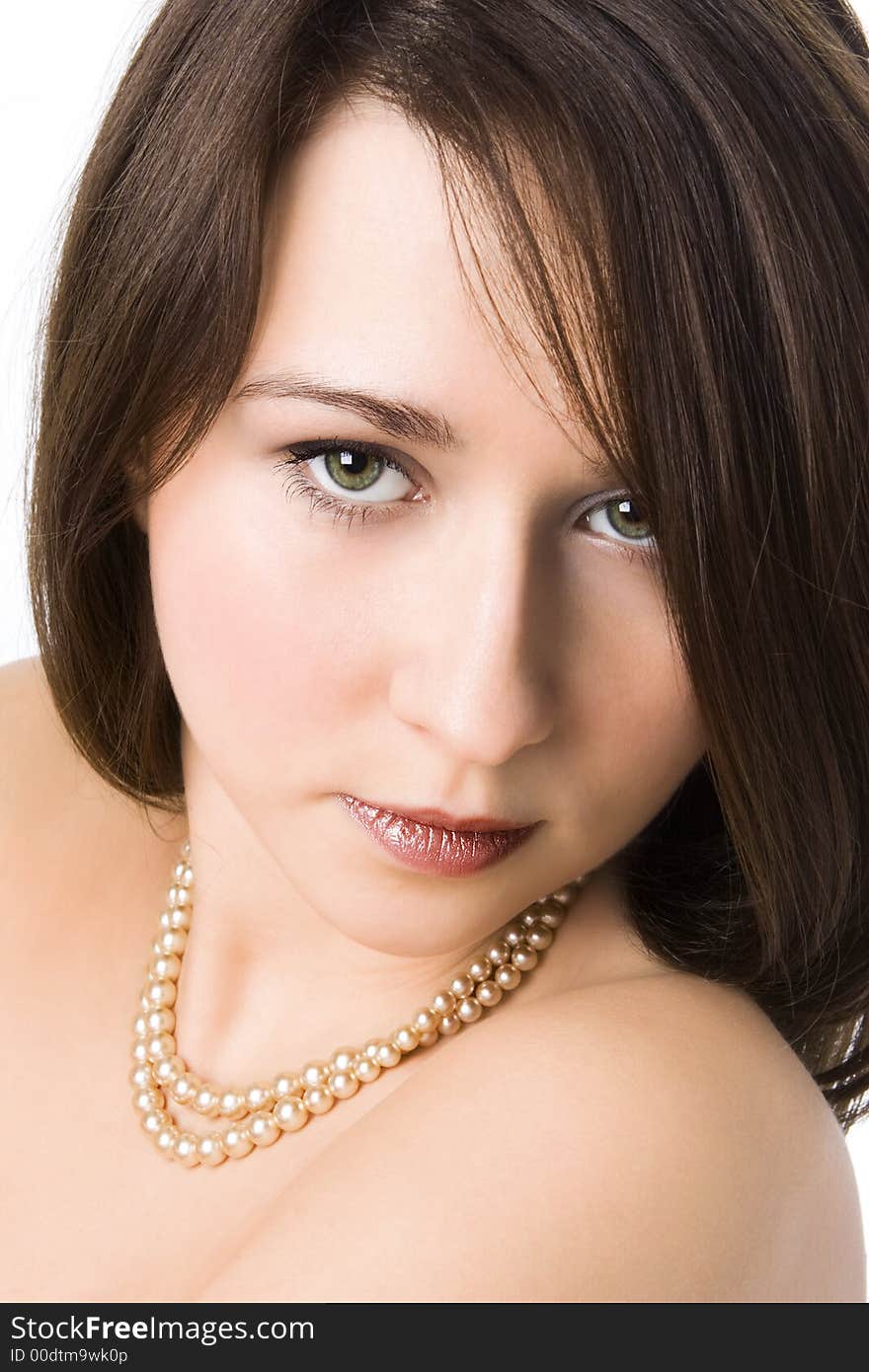 Portrait of the beautiful girl with a beads on a neck over white background. Portrait of the beautiful girl with a beads on a neck over white background