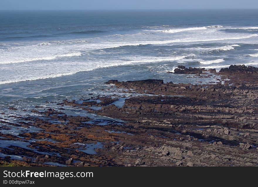 Waves coming over the rocks of a rocky coastline