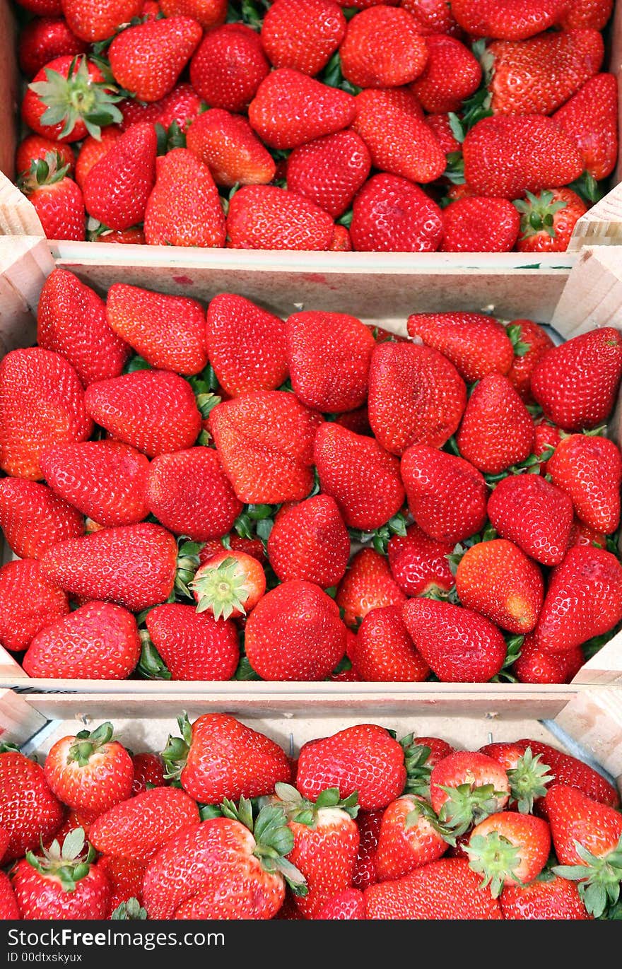 Strawberries on wooden box in the fruitshop. Strawberries on wooden box in the fruitshop