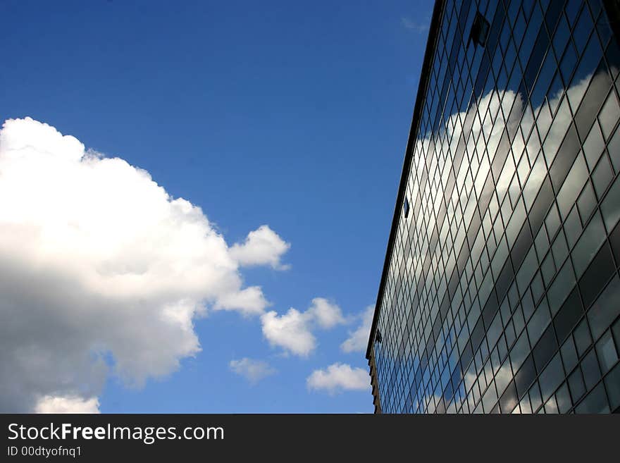 Skyscraper in Berlin serving as a mirror for the cloud. Skyscraper in Berlin serving as a mirror for the cloud