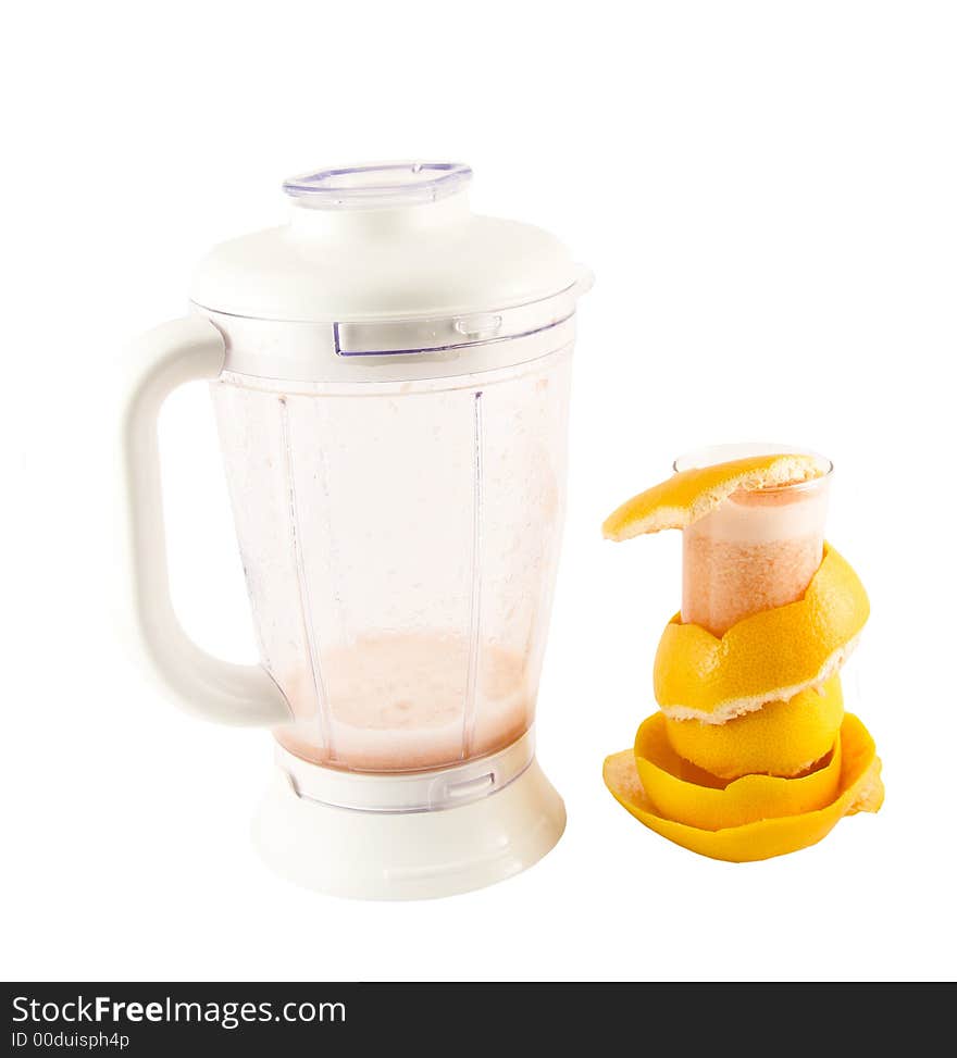 Glass with juice, grapefruit peel and a blender selected on a white background