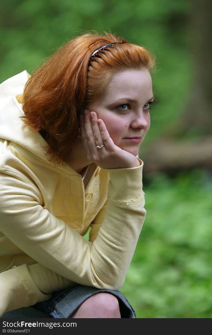 Portrait of the girl with red hair in a forest. Portrait of the girl with red hair in a forest