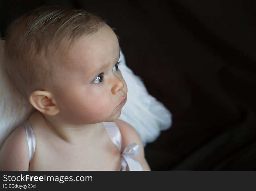 Image of baby wearing angel wings. Image of baby wearing angel wings