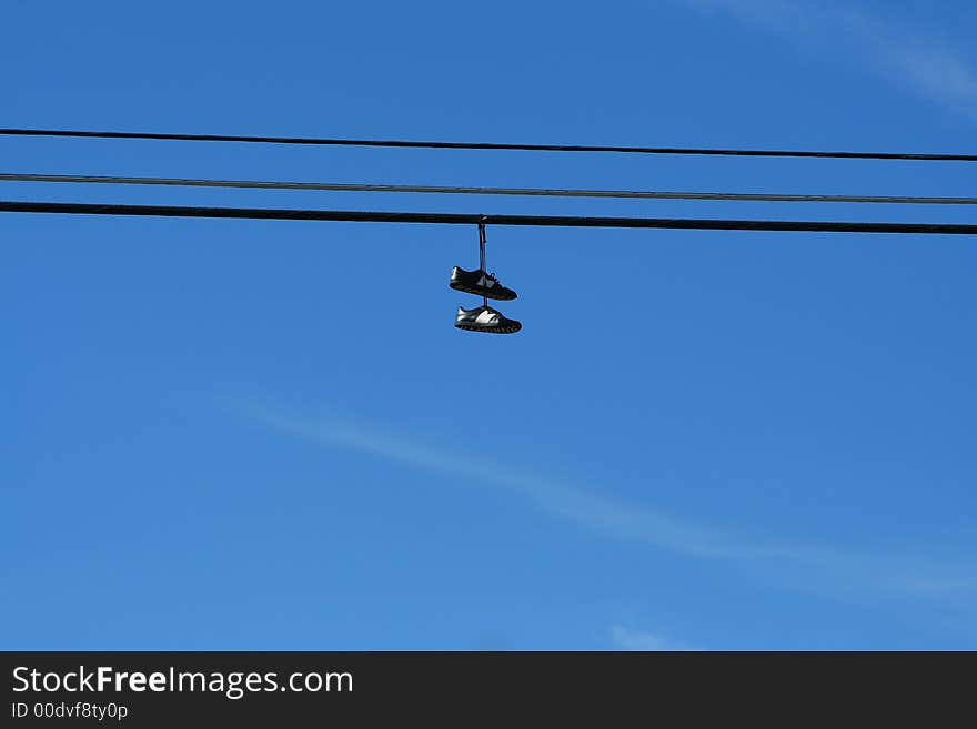 An image of a pair of hanging sneakers