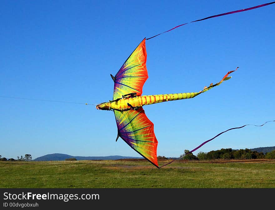 Colorful dragon kite against blue sky. Colorful dragon kite against blue sky