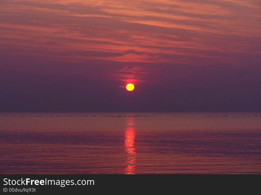 Orange and purple sunset on the beach