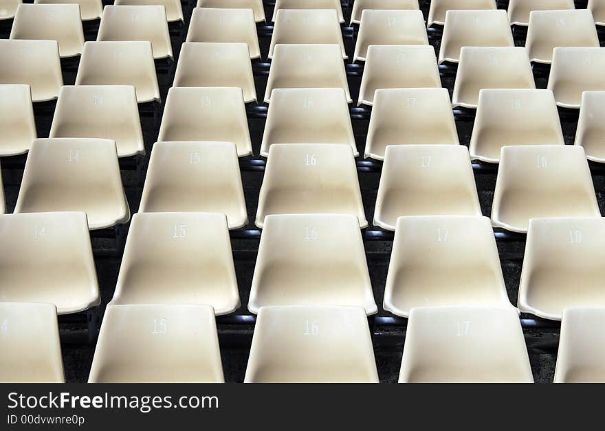 Many Empty Seats In Rows In An Outdoor Stadium. Many Empty Seats In Rows In An Outdoor Stadium