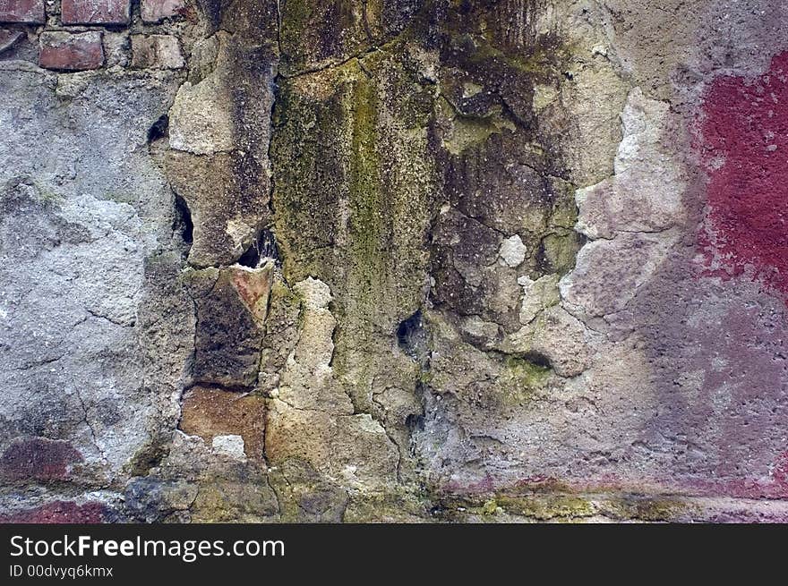 Obsolete and very damaged street building wall. Obsolete and very damaged street building wall