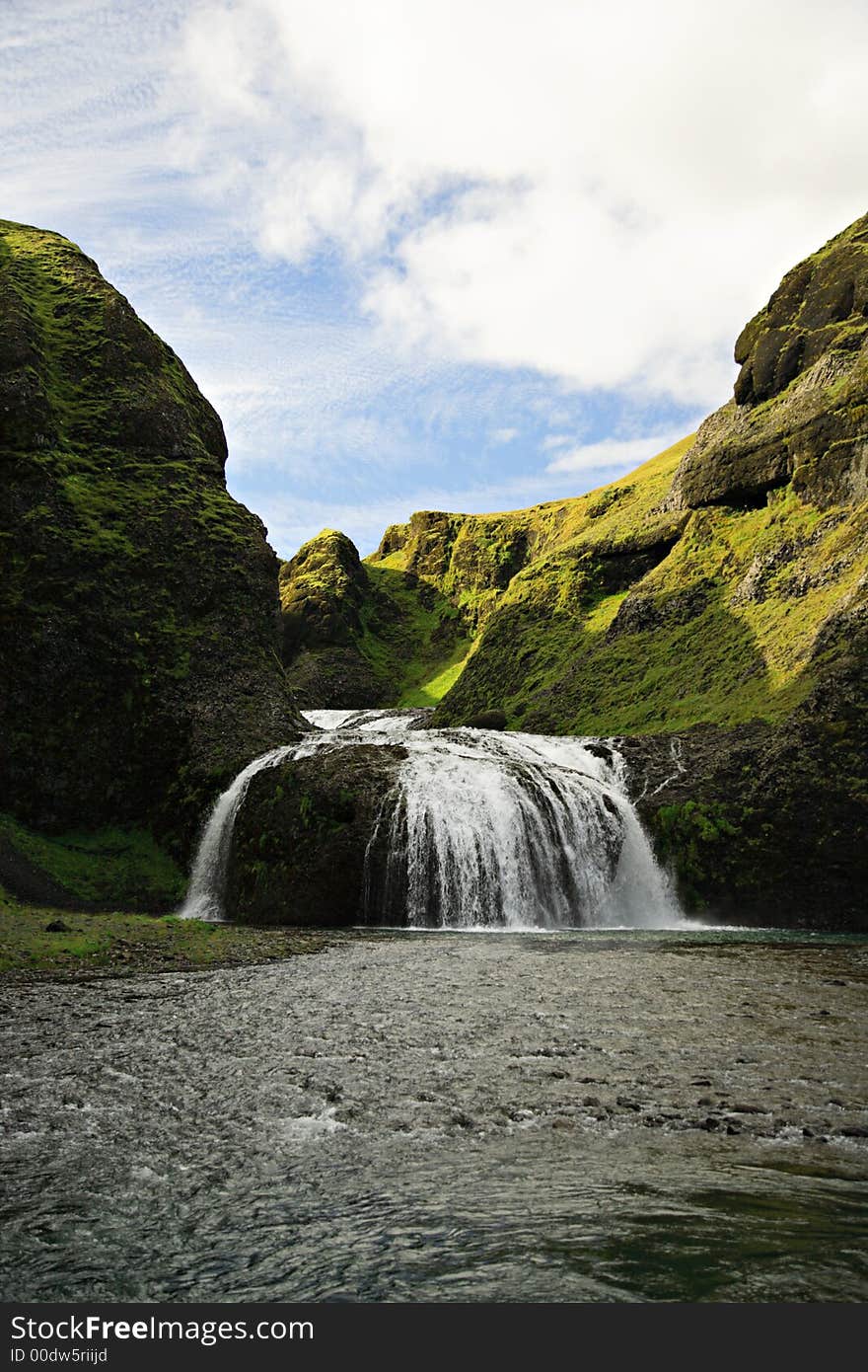 Stjornarfoss waterfall in Iceland on a sunny day