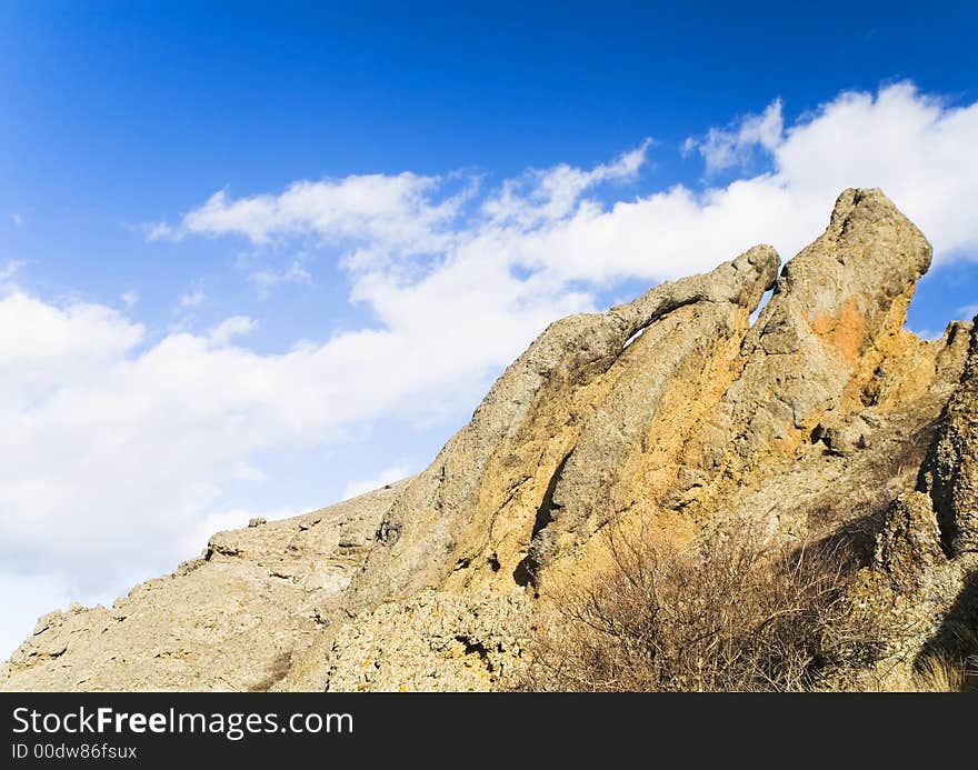 Yellow rock under bue sky. Yellow rock under bue sky