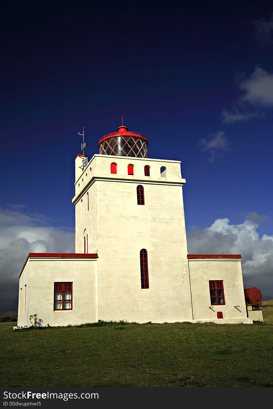 The lighthouse at Dyrholaey in Southern Iceland. The lighthouse at Dyrholaey in Southern Iceland