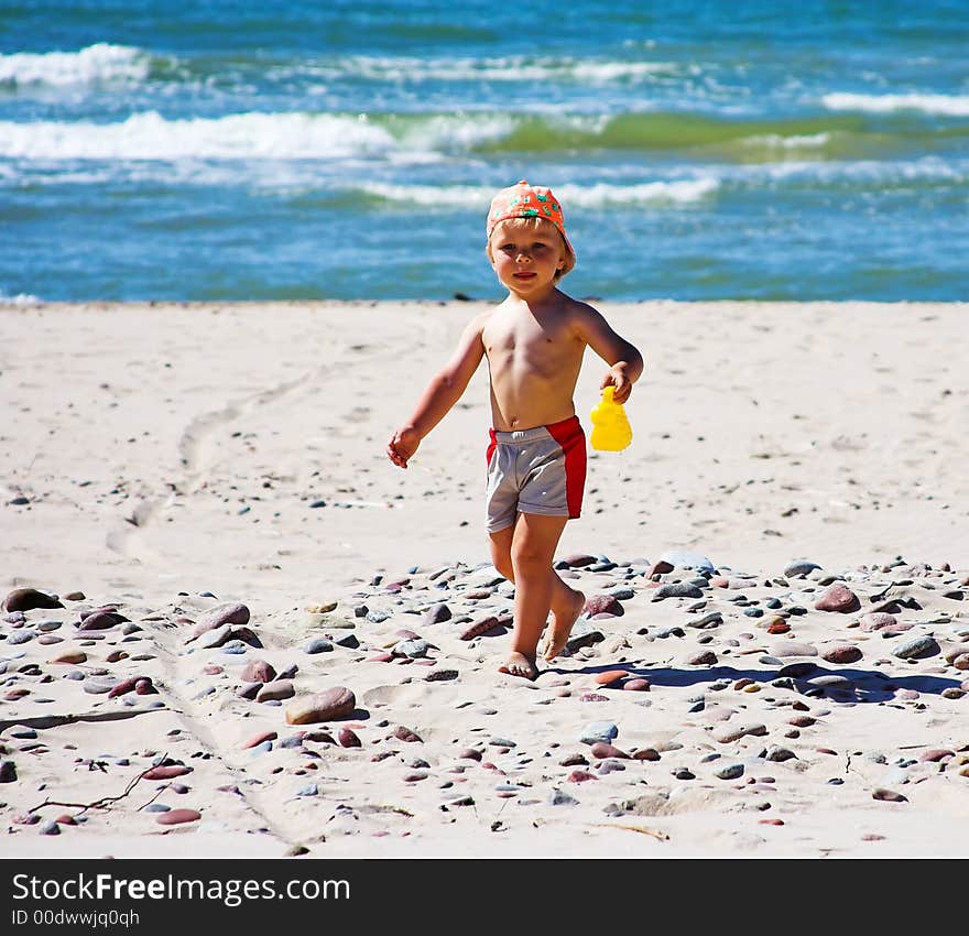 Young boy playing at the beach. Young boy playing at the beach.