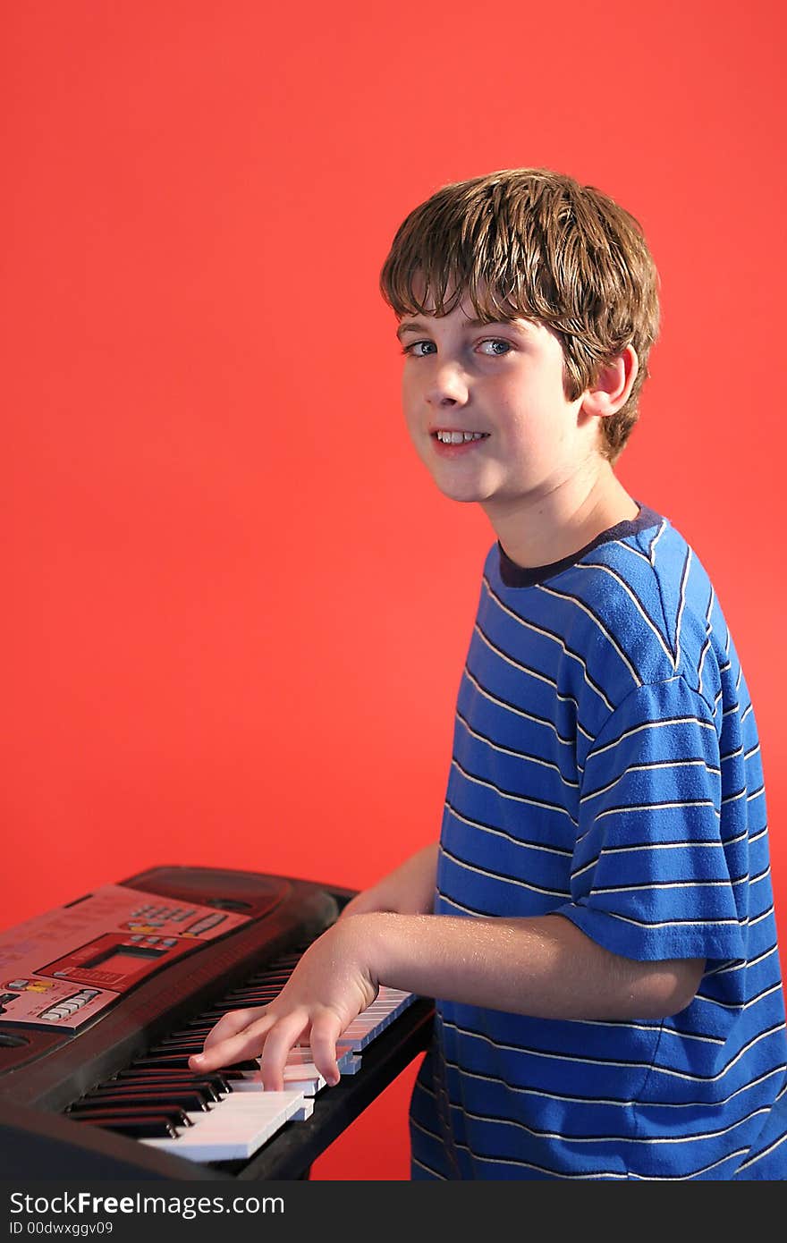 Boy on keyboard right vertical