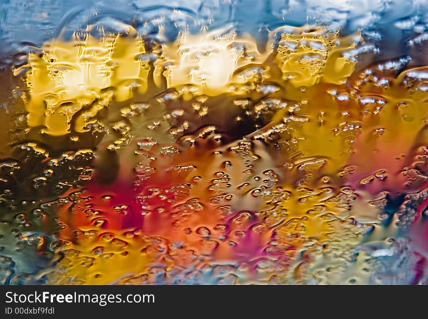 Colored drops on the glass, red, yellow, green, blue colors