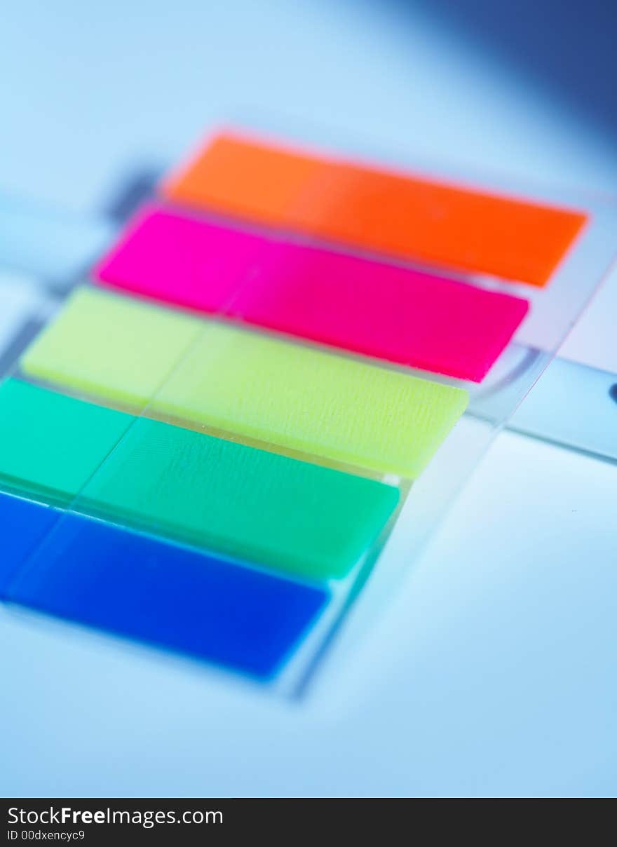 Multicoloured small plastic stickers macro. Multicoloured small plastic stickers macro