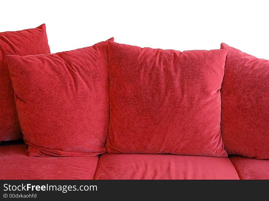 Red sofa with velvet pillows