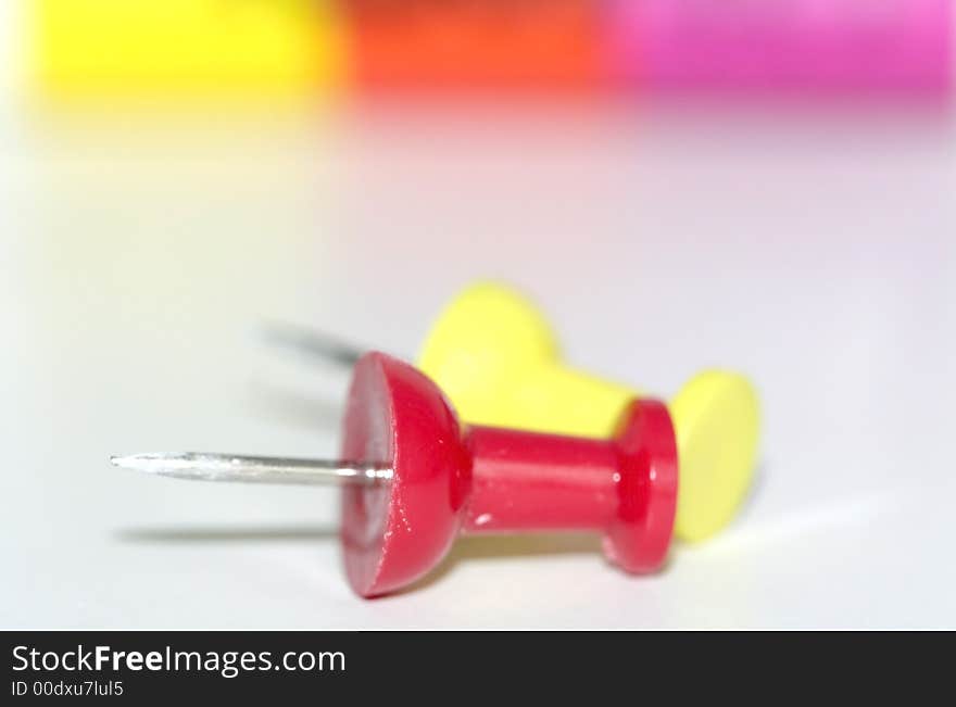 An abstract of red and yellow push pins