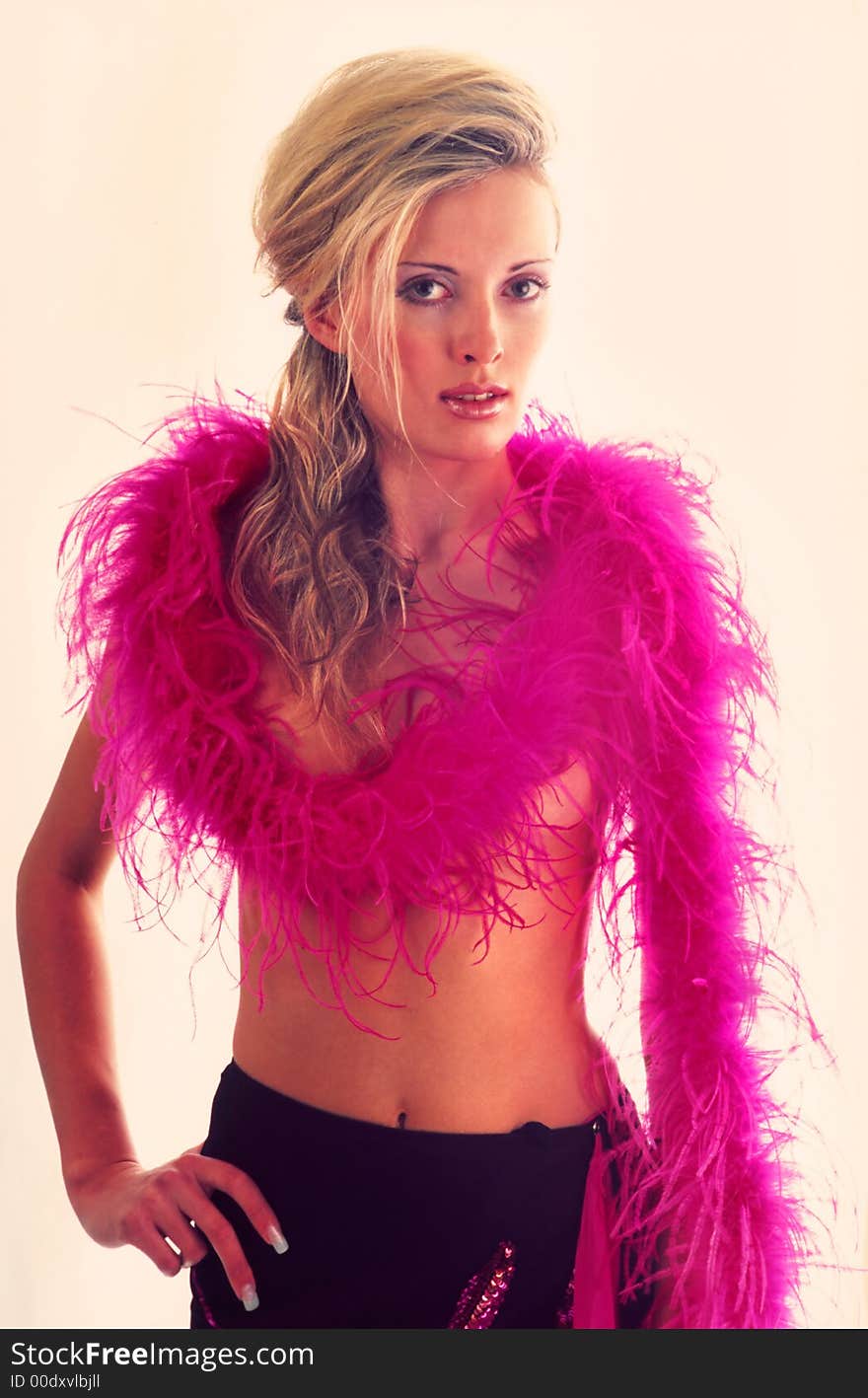 Portrait of  woman with thrown over shoulders of  boa of brightly pink color on  white background. Portrait of  woman with thrown over shoulders of  boa of brightly pink color on  white background