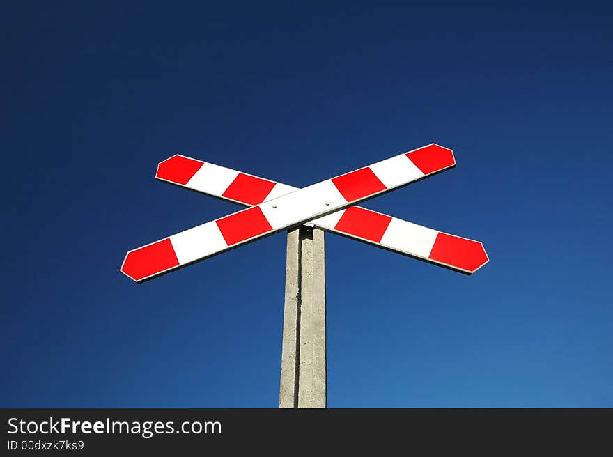 red-white railway sign on blue