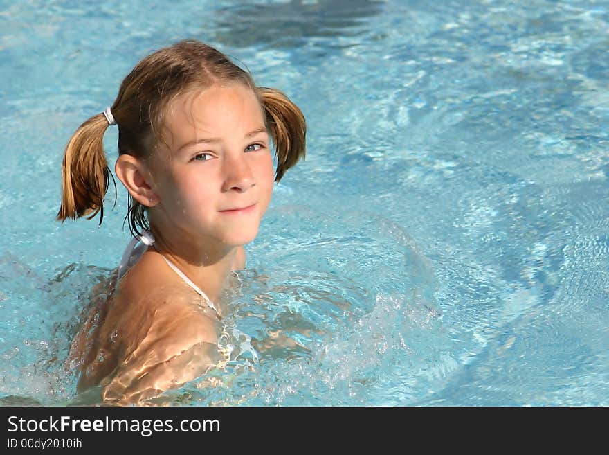 Girl Swimming In The Pool