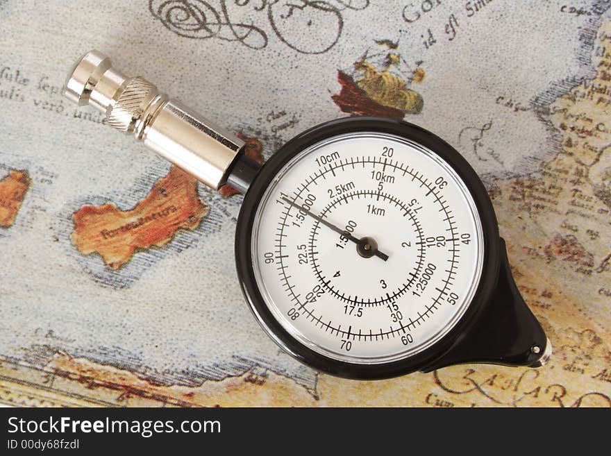 Map measurer on an old map. Map measurer on an old map