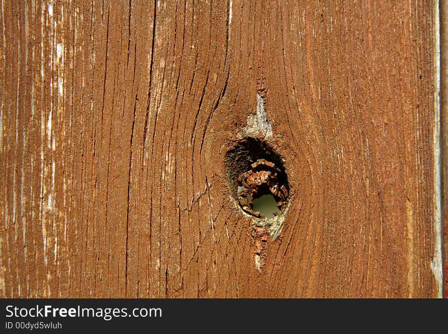 An old wooden board with hole