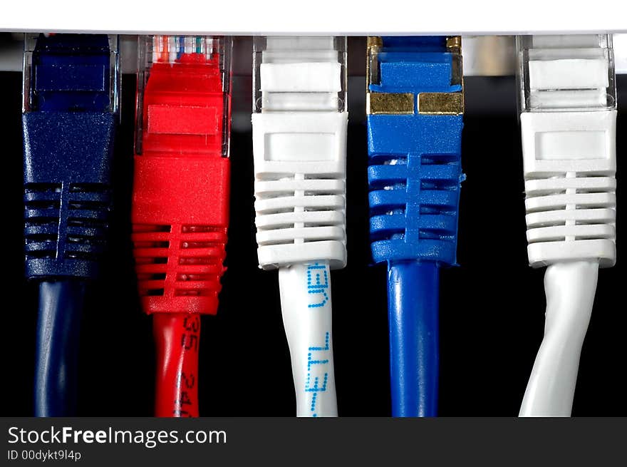 Network cable in three different colors witha black background. Network cable in three different colors witha black background