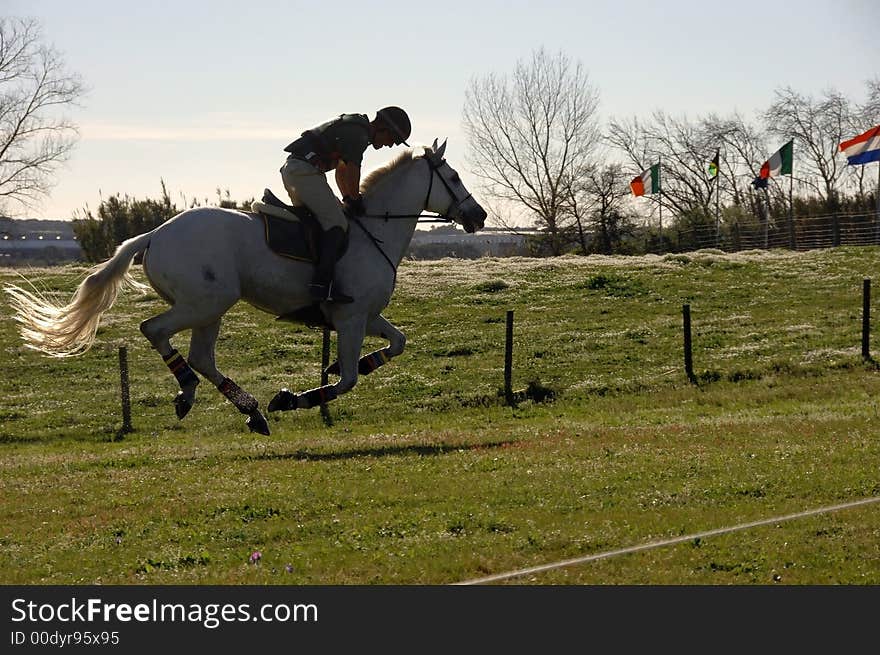 Horseman galloping at high speed in horse racing