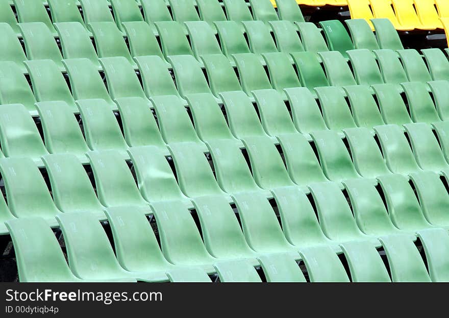 Many Empty Seats In Rows In An Outdoor Stadium. Many Empty Seats In Rows In An Outdoor Stadium