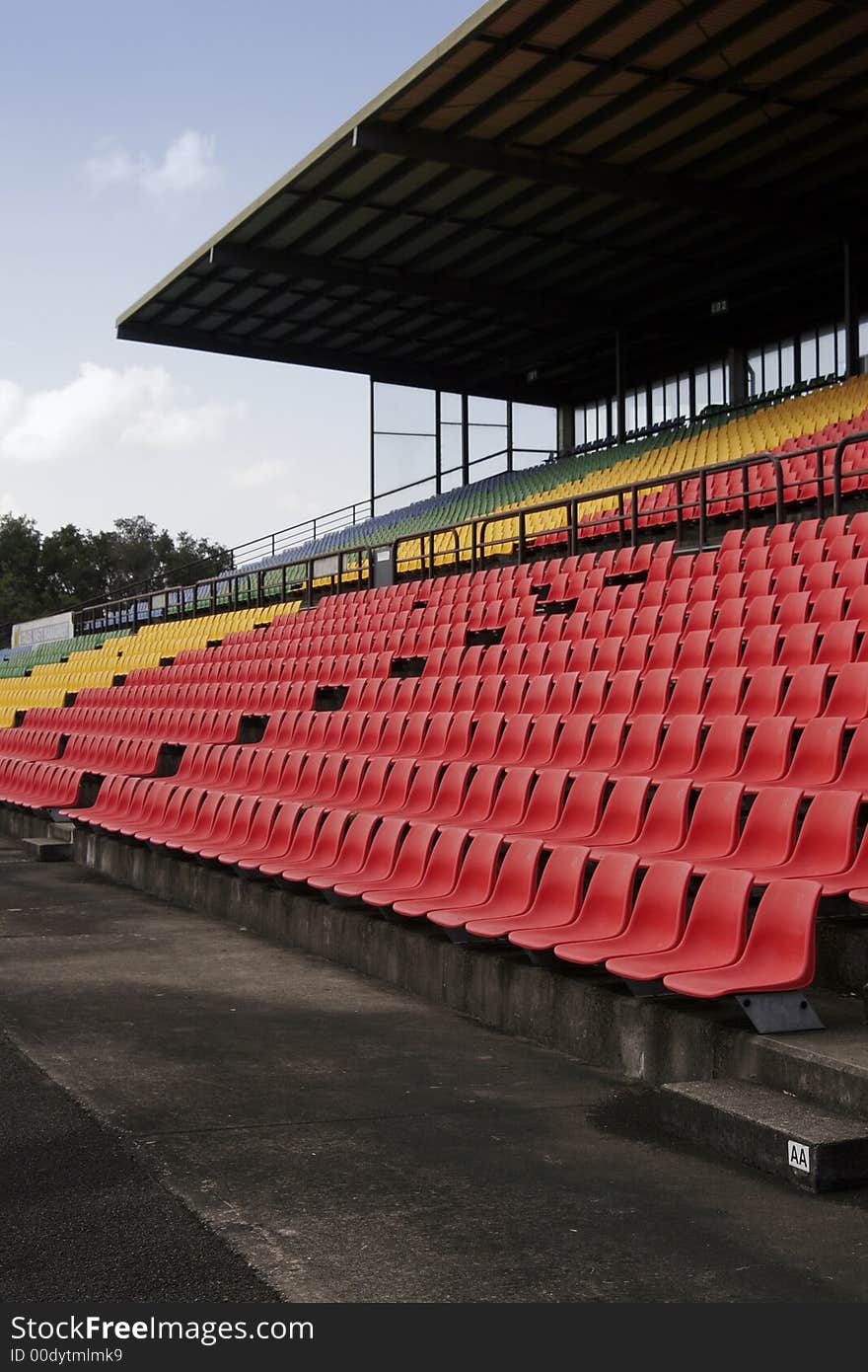 Many Empty Seats In Rows In An Outdoor Stadium. Many Empty Seats In Rows In An Outdoor Stadium