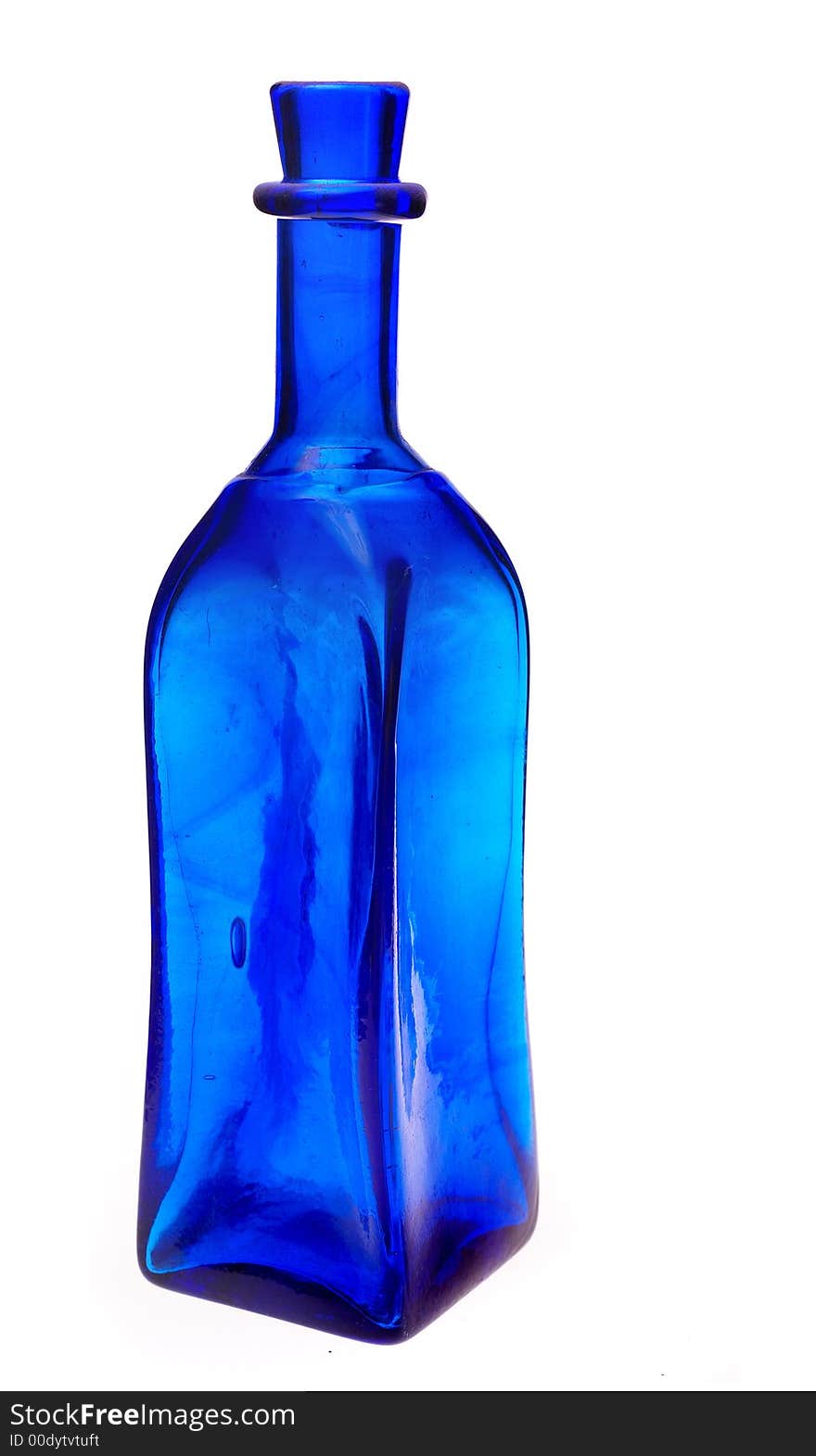 Cobalt blue colored medicine bottle - antique on white background