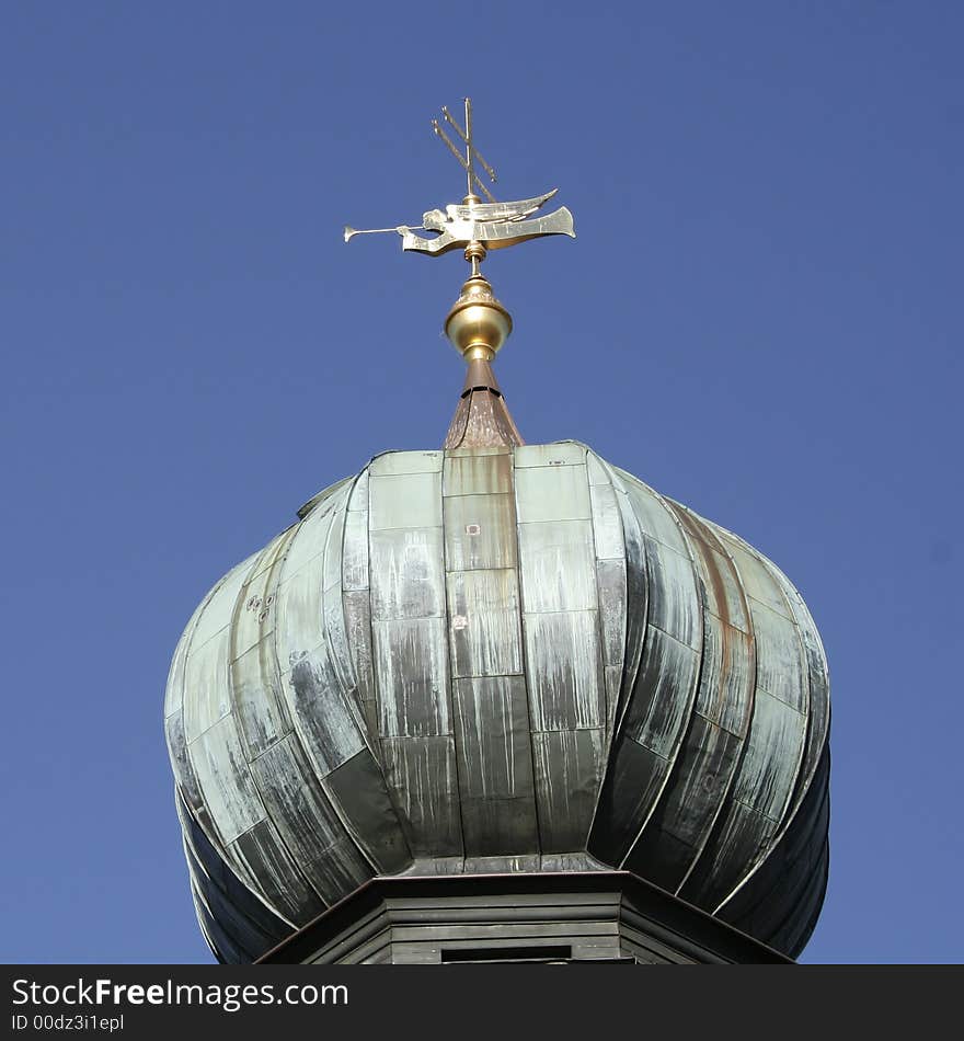 Churchtower with angel and cross