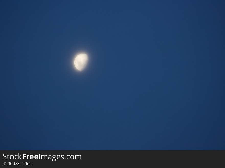 A moon in a foggy setting making it eerie. A moon in a foggy setting making it eerie