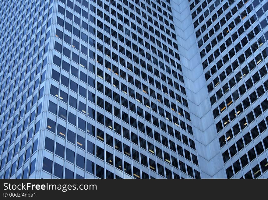 Three dimensions of a blue glass-windowed skyscraper. Three dimensions of a blue glass-windowed skyscraper.