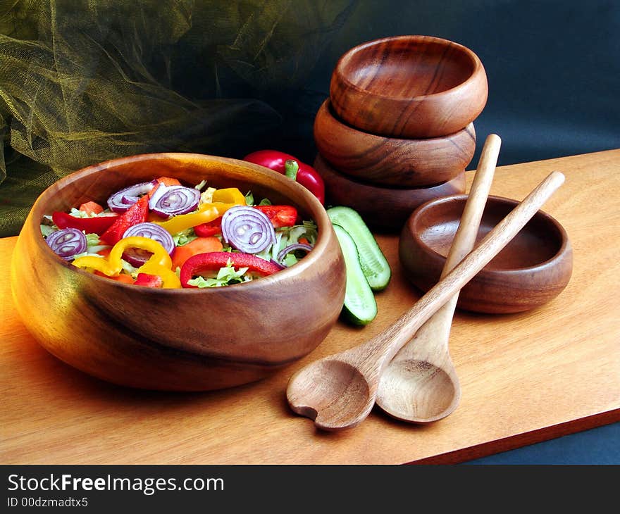 Salad from vegetables in wooden utensils