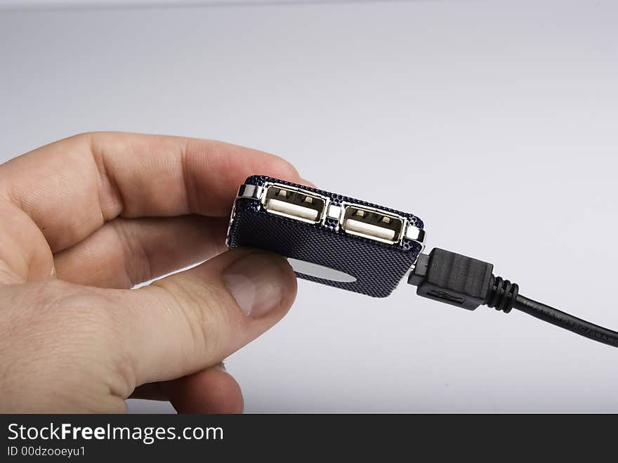 Usb hub hold by hand on a white background